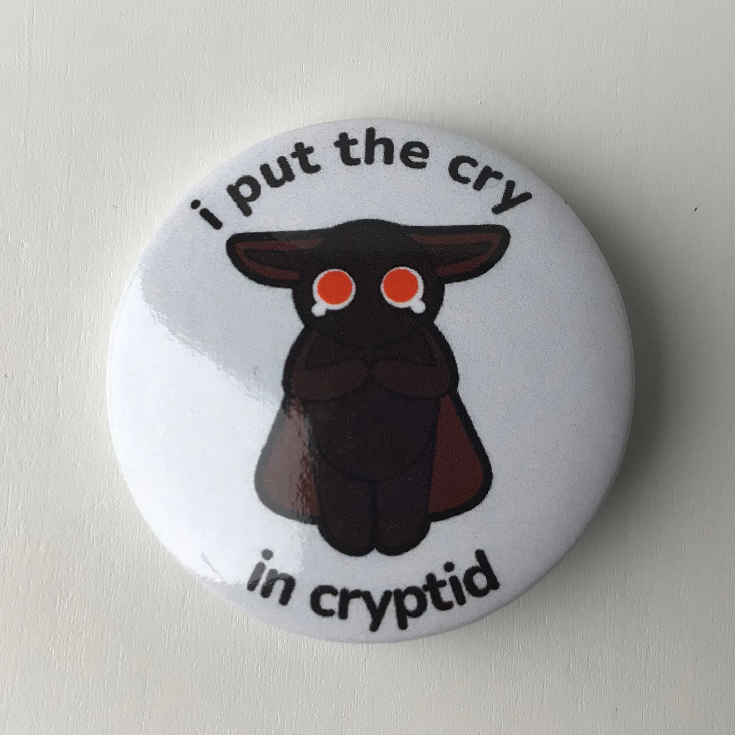 Crying Cryptid Button Badge